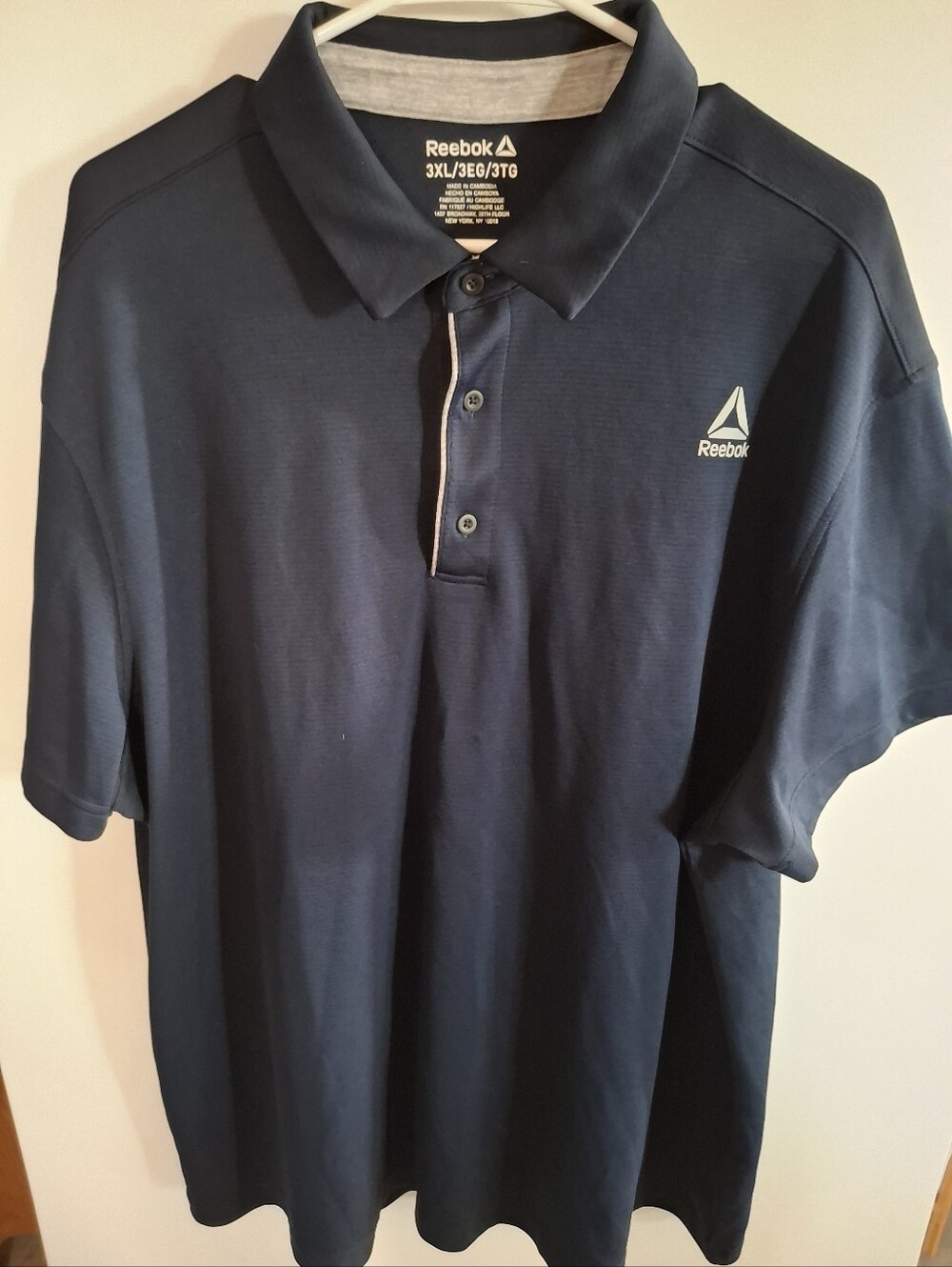 Reebok Men's Dark Navy Polo Shirt with White Logo